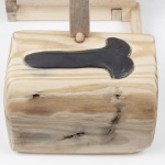 bookend to rupture, transform, repair, and care | 18.5in x 19in x 8in | reclaimed clay, reclaimed wood from shipping pallet, hand spun fiber reclaimed from discarded clothing, clay dug from the Niagara region, milkweed seed ball, milkweed tussock moth, beeswax, gold leaf, epoxy